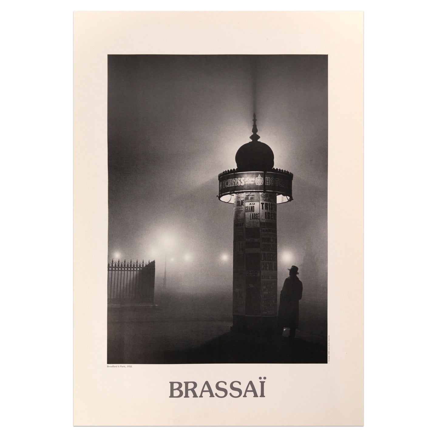 Brassaï poster featuring a black and white photograph of a man standing under a light in a foggy night